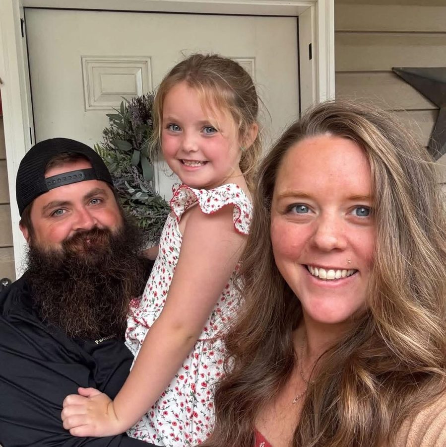 Clayton with his wife and daughter on their front porch
