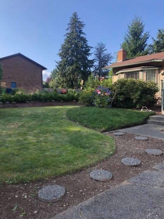 After: front lawn mowed and edged with clean beds
